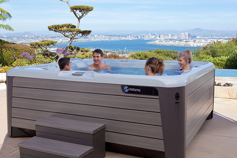 A group of friends is having a soak in the roomy Grandee.
