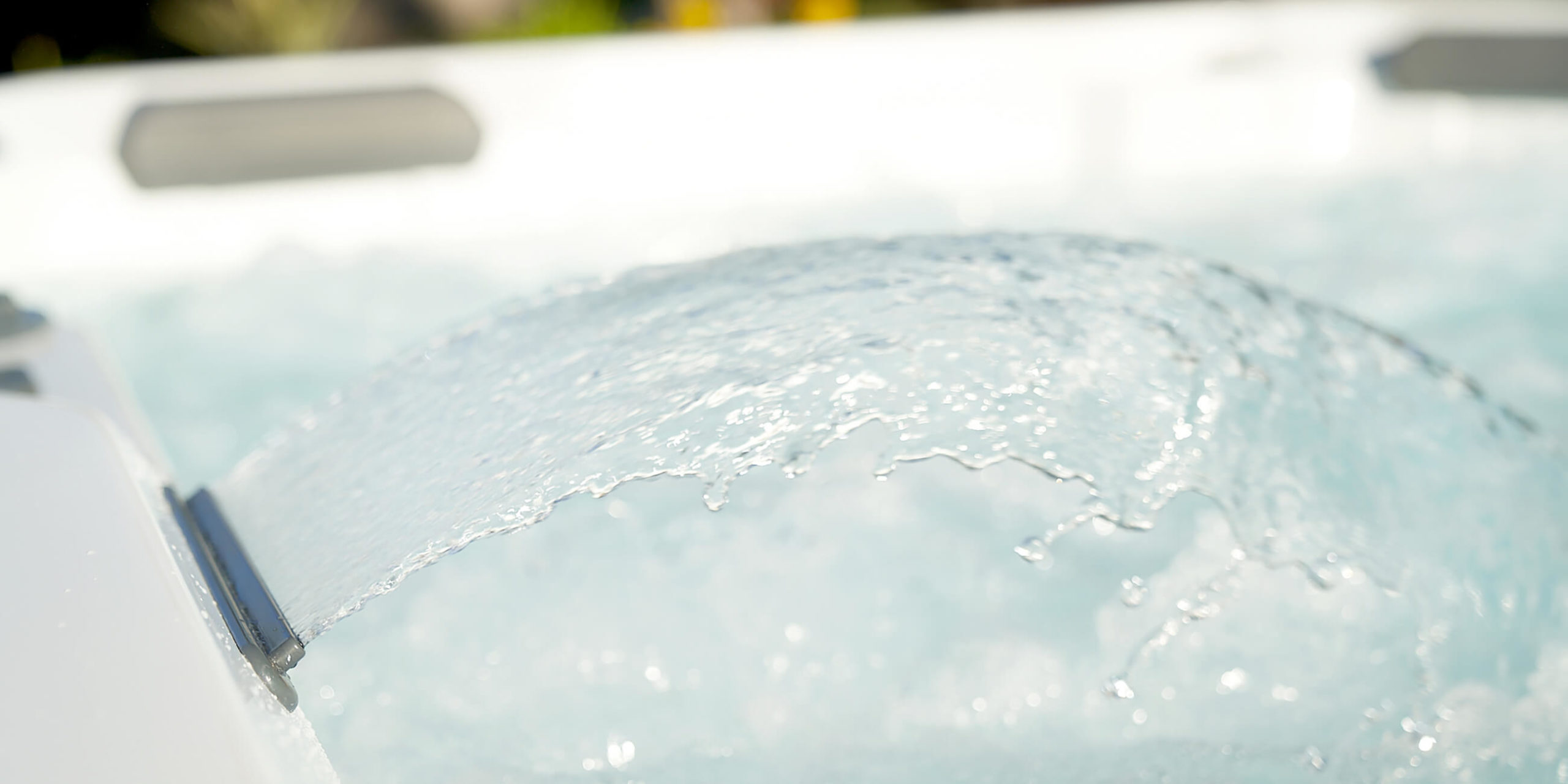 https://www.hotspring.com/wp-content/uploads/2022/03/hot-spring-spas-hot-spot-collection-page-cspot-lifestyle-waterfall-feature-scaled.jpg