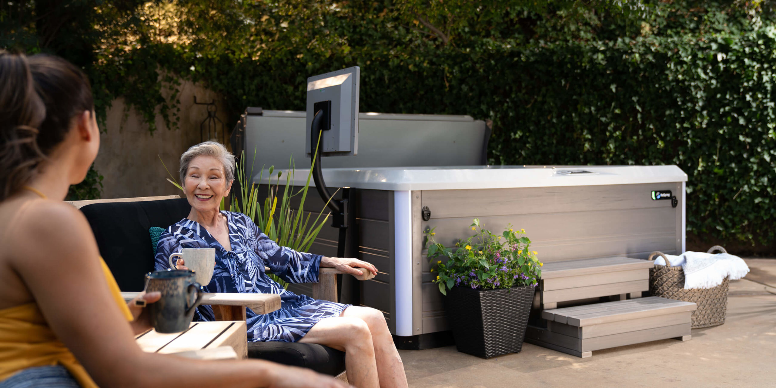 https://www.hotspring.com/wp-content/uploads/2022/03/hot-spring-spas-limelight-collection-page-cspot-lifestyle-women-sitting-near-spa-1-scaled.jpg