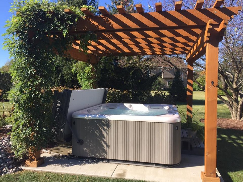 A pergola is a great hot tub privacy solution.