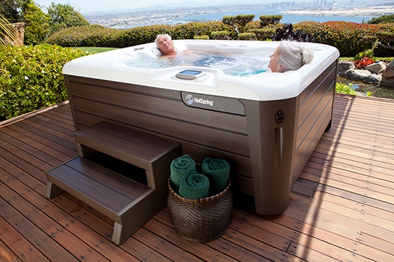 a couple relaxes in their super energy efficient Jetsetter hot tub