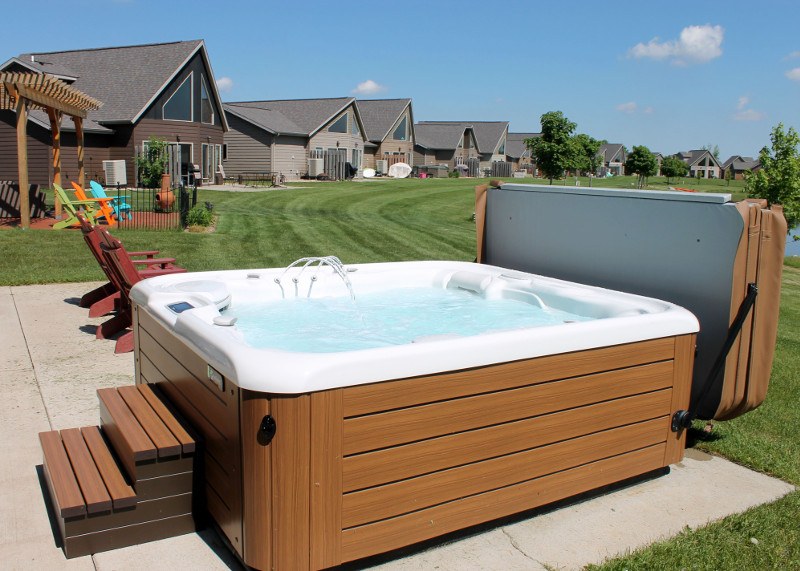 A spa cover lifter or spa-side umbrella can create hot tub privacy.