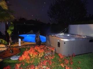 Hot Spring Spa at night in backyard
